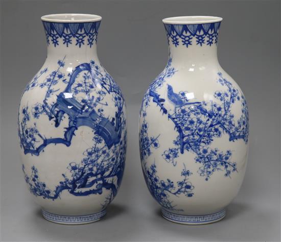 A pair of Japanese Meiji period blue and white baluster vases height 25cm